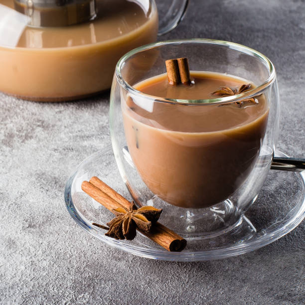 istock MasalaMasala tea in ceramic cup with spices on light gray stone table background. Indian tea 939488806