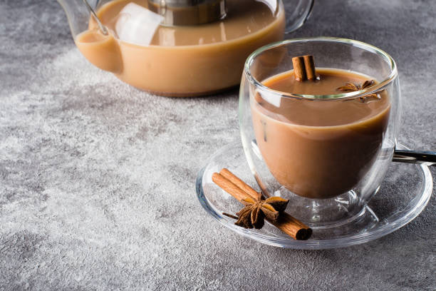 istock MasalaMasala tea in ceramic cup with spices on light gray stone table background. Indian tea 939488838