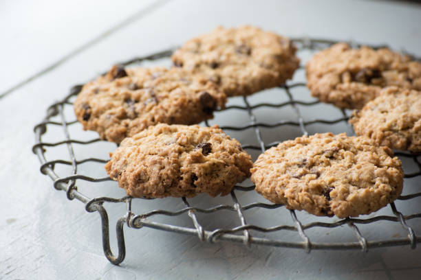 istock Chewy homemade oatmeal biscuits on a wire cooling rack 939489062