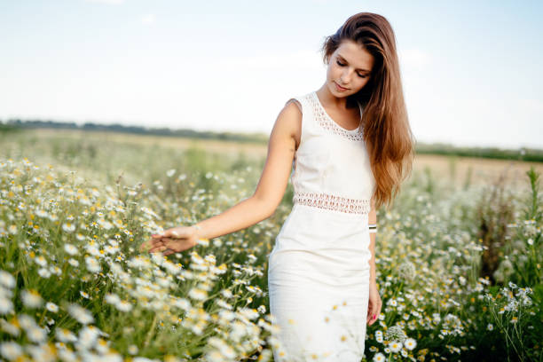 istock Young beautiful woman spending time in nature 939490176