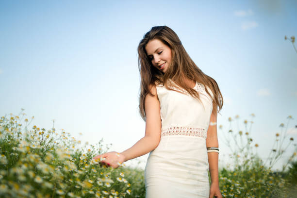 istock Young beautiful woman spending time in nature 939490210