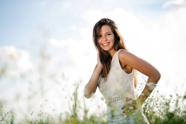 istock Young beautiful woman spending time in nature 939490274