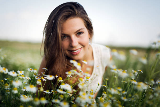 istock Young beautiful woman spending time in nature 939490932