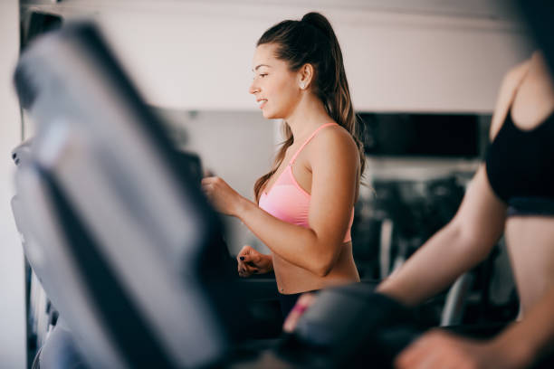 istock Girls exercising in the gym. 939493414