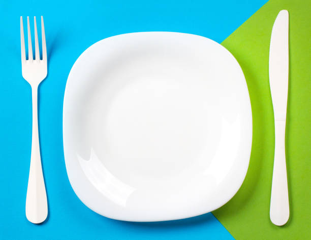 istock Plate fork knife Cutlery Kitchen concept restaurant menu meal art background blue green 939494404