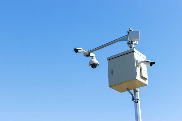 istock three cameras Cctv technology, video photography on the sky background 939494496