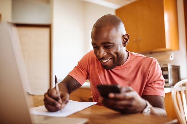 istock man doing the own home finance 939497962