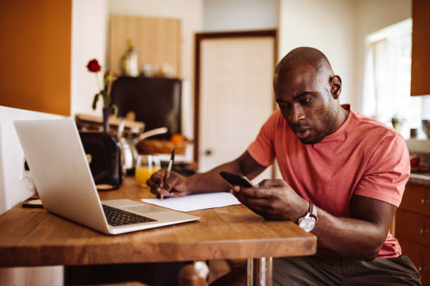 istock man doing the own home finance 939498284
