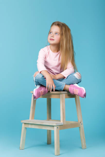 istock little girl in pink sweater 939498558