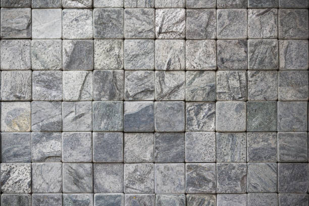 istock grey cube stone wall background and texture, rock seamless floor 939498620