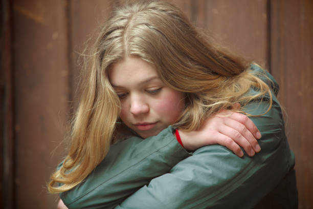 istock Sad looking young woman sitting. 939499010