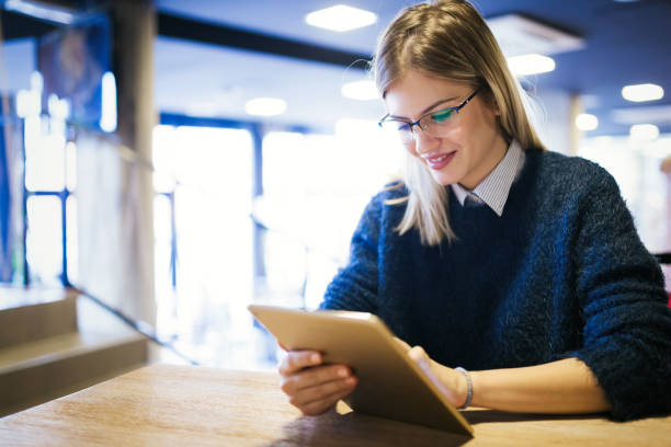 istock Portrait of young attractive woman using tablet 939501714