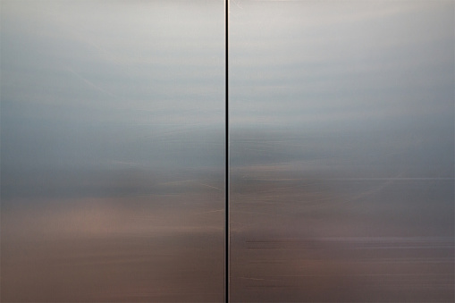 stainless steel elevator door background and texture, close metal door