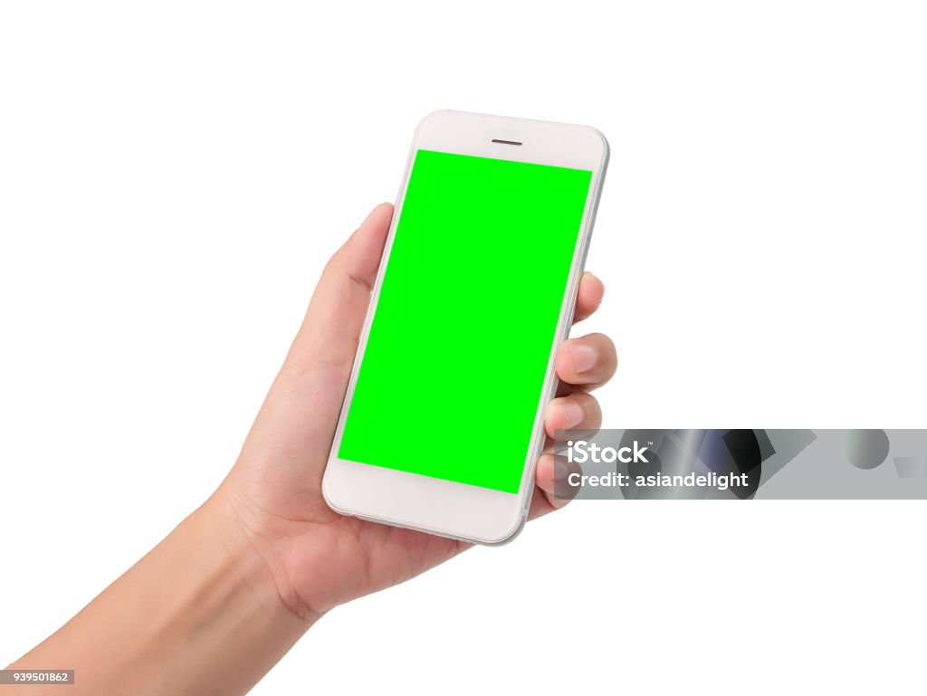 woman hand holding a modern mobile smart phone with blank green screen isolated on white background with clipping path. blank green screen to put your own message Smart Phone Stock Photo