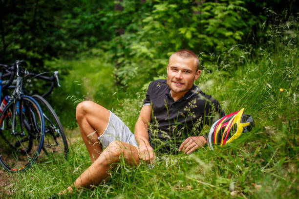 istock Positive male resting on a grass. 939505244