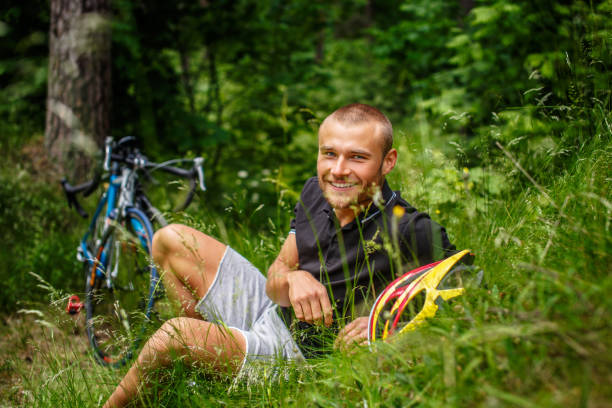 istock Positive male resting on a grass. 939506798