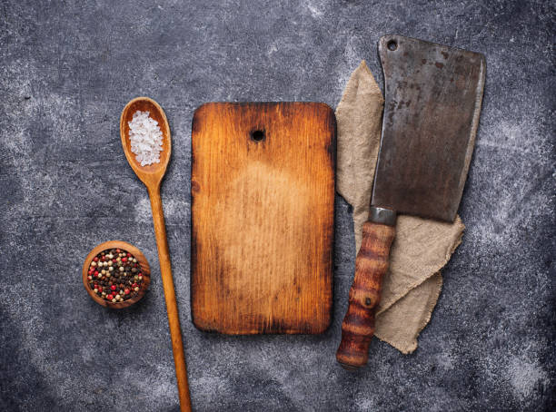 istock Culinary background with spices, cutting board and hatchet 939508976