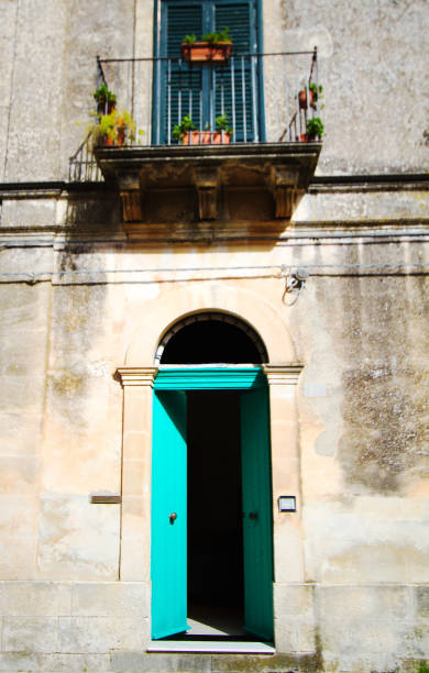 istock Italian House: Vibrant Arched Green Door (Open): Mottled Wall 939509262