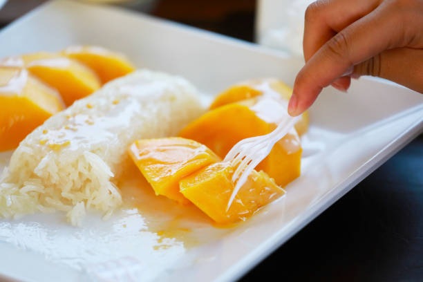 mango and sticky rice,Thai style tropical dessert, glutinous rice eat with mangoes