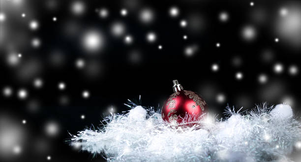 istock beautiful red Christmas ball on a black background 939510466