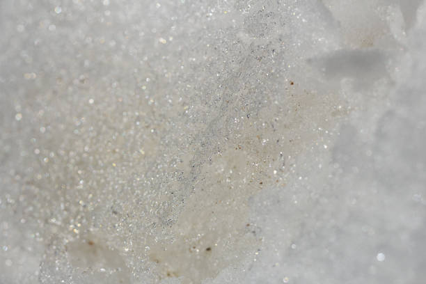 istock Texture of melting snow, ice crystals close-up. Abstract background 939544054