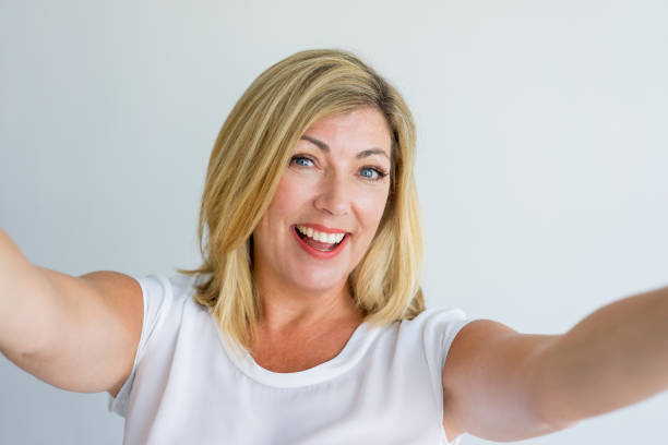 istock Cheerful optimistic woman making selfie 939550320