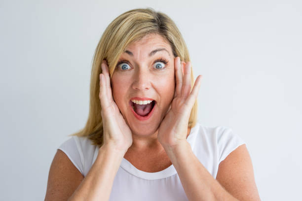 istock Happy amazed woman screaming in excitement 939552630