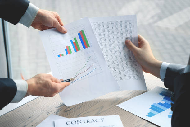 istock close up.business colleagues discussing a financial chart 939566540