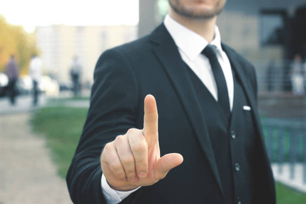 istock close up.businessman showing index finger up 939566780