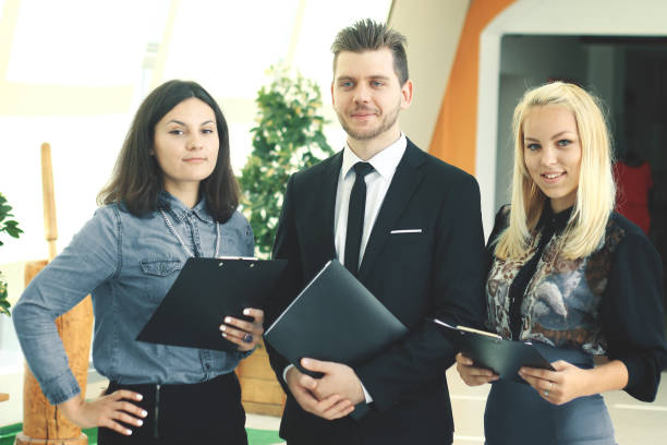istock close up.businessman and staff standing in creative office 939567064