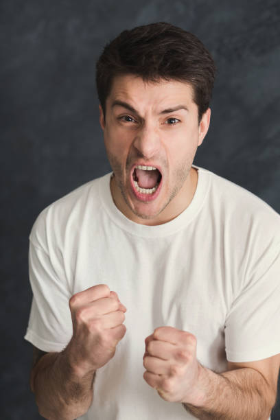 istock Portrait of angry crying man 939568086