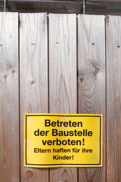 istock Construction fence, sign entering the construction site prohibited 939570784