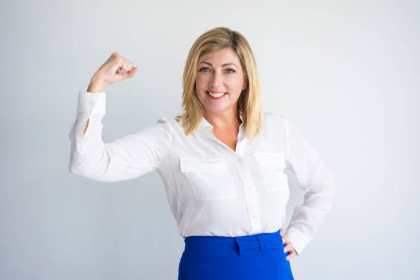 istock Confident Caucasian Business Woman Flexing Bicep 939571004