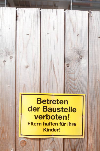 istock Construction fence, sign entering the construction site prohibited 939571058