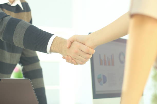 istock closeup.the handshake between colleagues in the workplace. 939571274