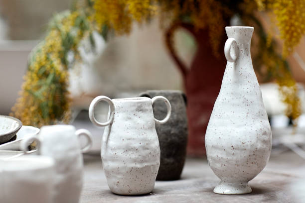 istock Close-up of clay containers in pottery class 939572280