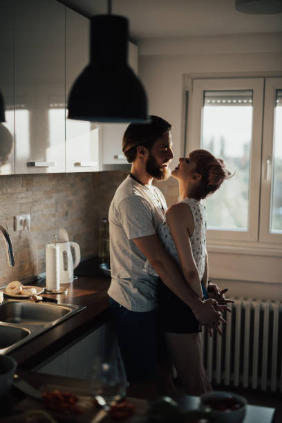 istock Passionate couple embracing in the kitchen 939578532