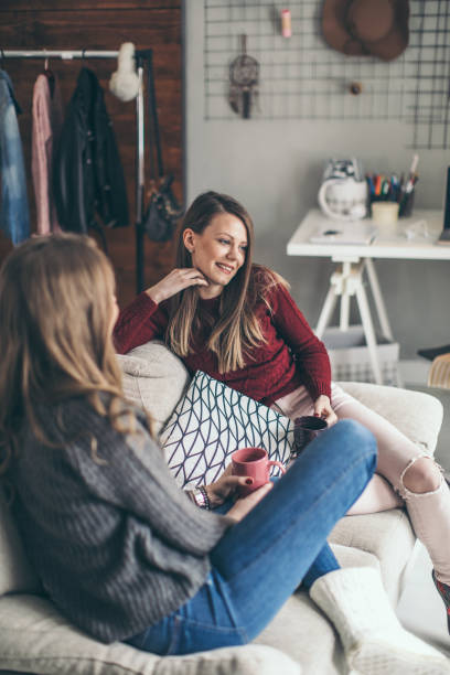 istock Two college girls relaxing 939578704