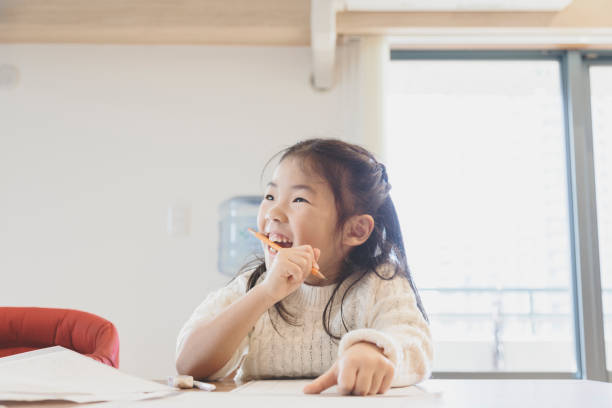 istock Girl studying at home 939578800