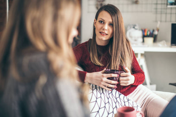 istock Two college girls relaxing 939578826