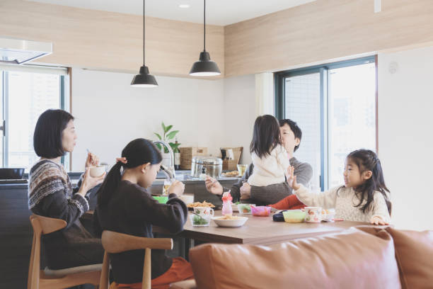 istock Family having lunch at home 939578914