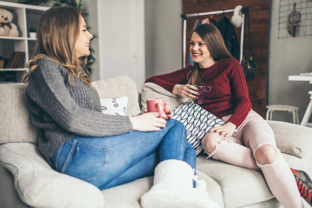 istock Two college girls relaxing 939579034
