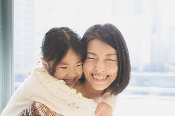 istock Mother and daughter relaxed at home 939579276