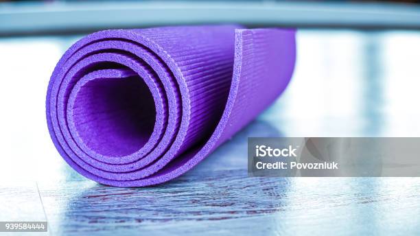 Mat For Sports And Yoga On The Floor In The Gym Stock Photo - Download Image Now - Learning, Pilates, Yoga Class
