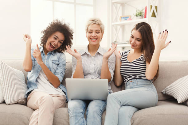 istock Three beautiful women using laptop at home 939584810