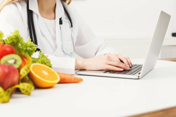 istock Female nutritionist working on laptop 939585094