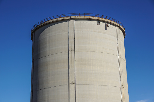 old cement silos and blue sky background .