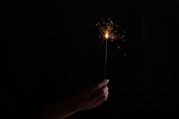 istock Female hands holding bengal light. 939590660