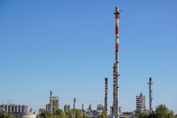 istock Industrial power plant with blue sky background 939593416
