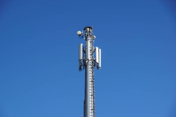 istock Technology on the top of the telecommunication GSM 4G tower antenna, transmitter , blue sky, white clouds. 939593950